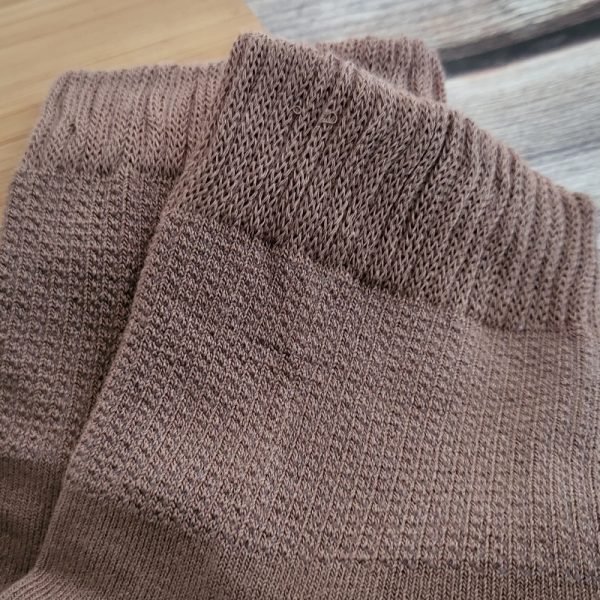 close look at leg opening of brown socks