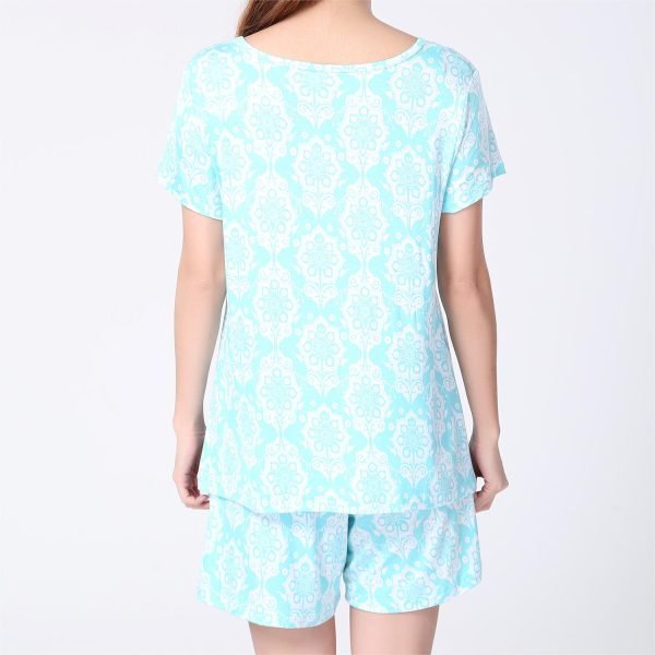 back of a girl wearing blue pirnted short sleeves and shorts