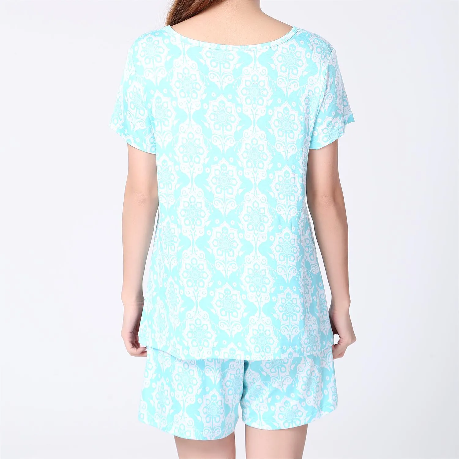 back of a girl wearing blue pirnted short sleeves and shorts