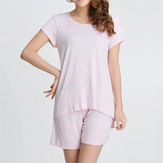 A girl wearing pink short sleeves and shorts