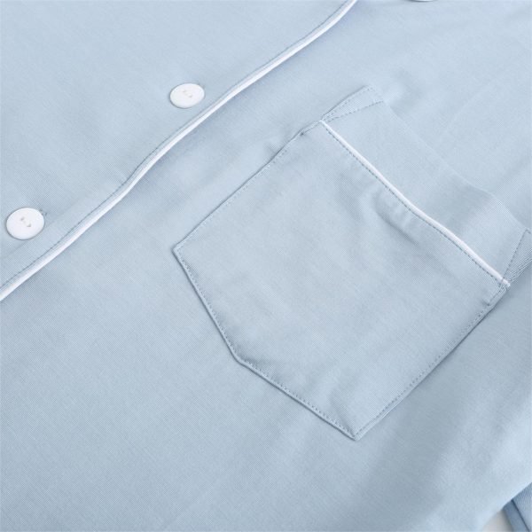 pocket and buttons of sky blue garment
