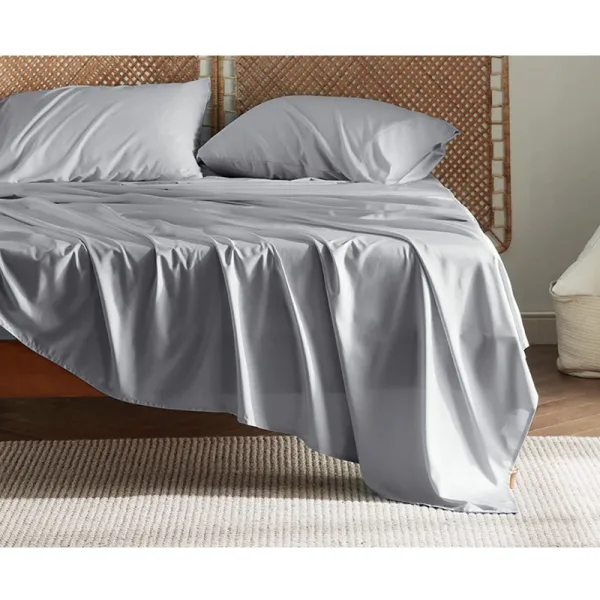 bed with light gray bedding