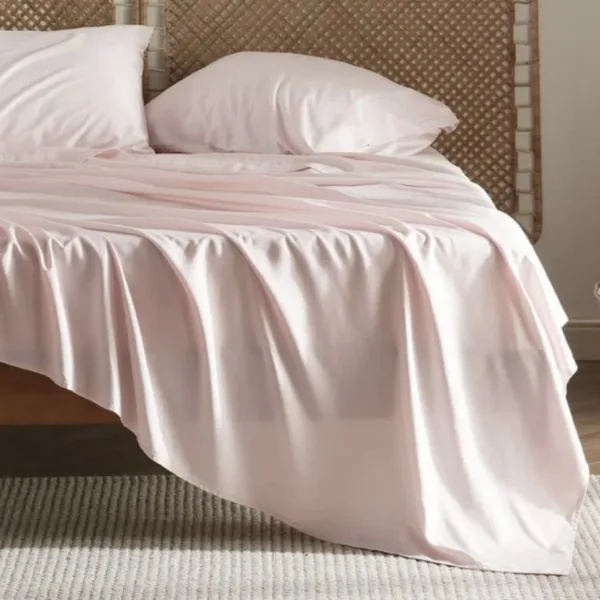 bed with baby pink bedding