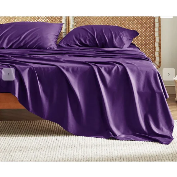bed with purple bedding